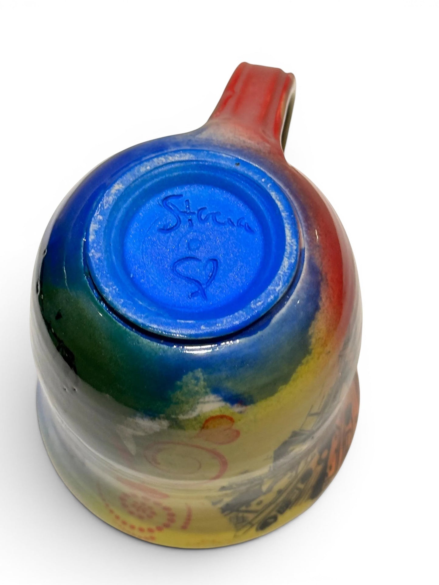 Rock N Art Shop handmade 12 oz stoneware mug with vibrant, abstract rock n roll Jesus art. Features blue interior and red handle.