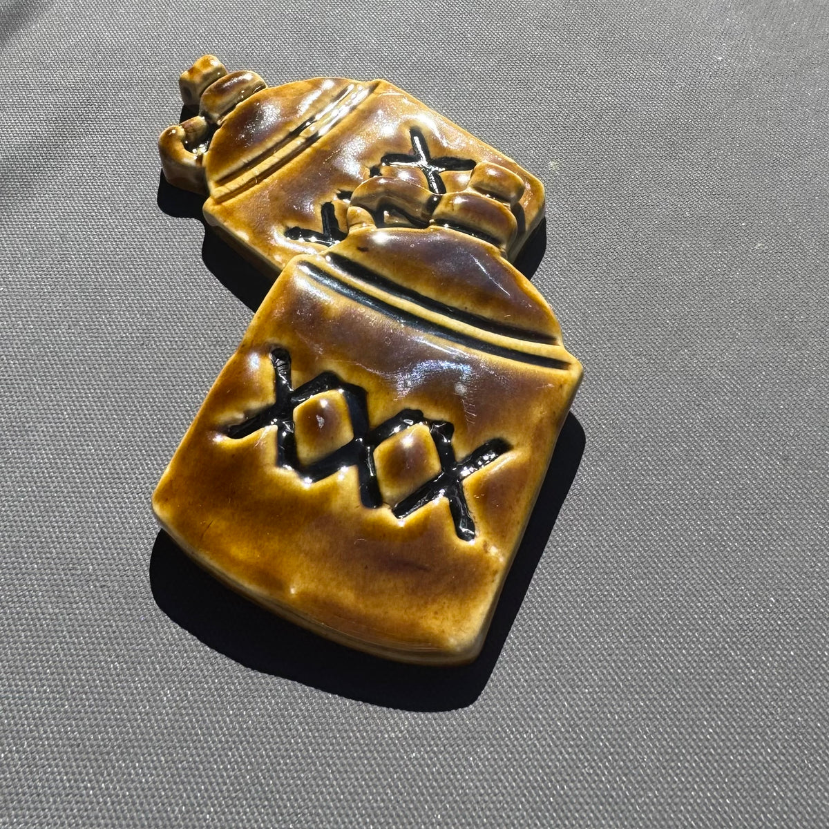 XXX Moonshine Jug Ceramic Magnet – Amber Brown