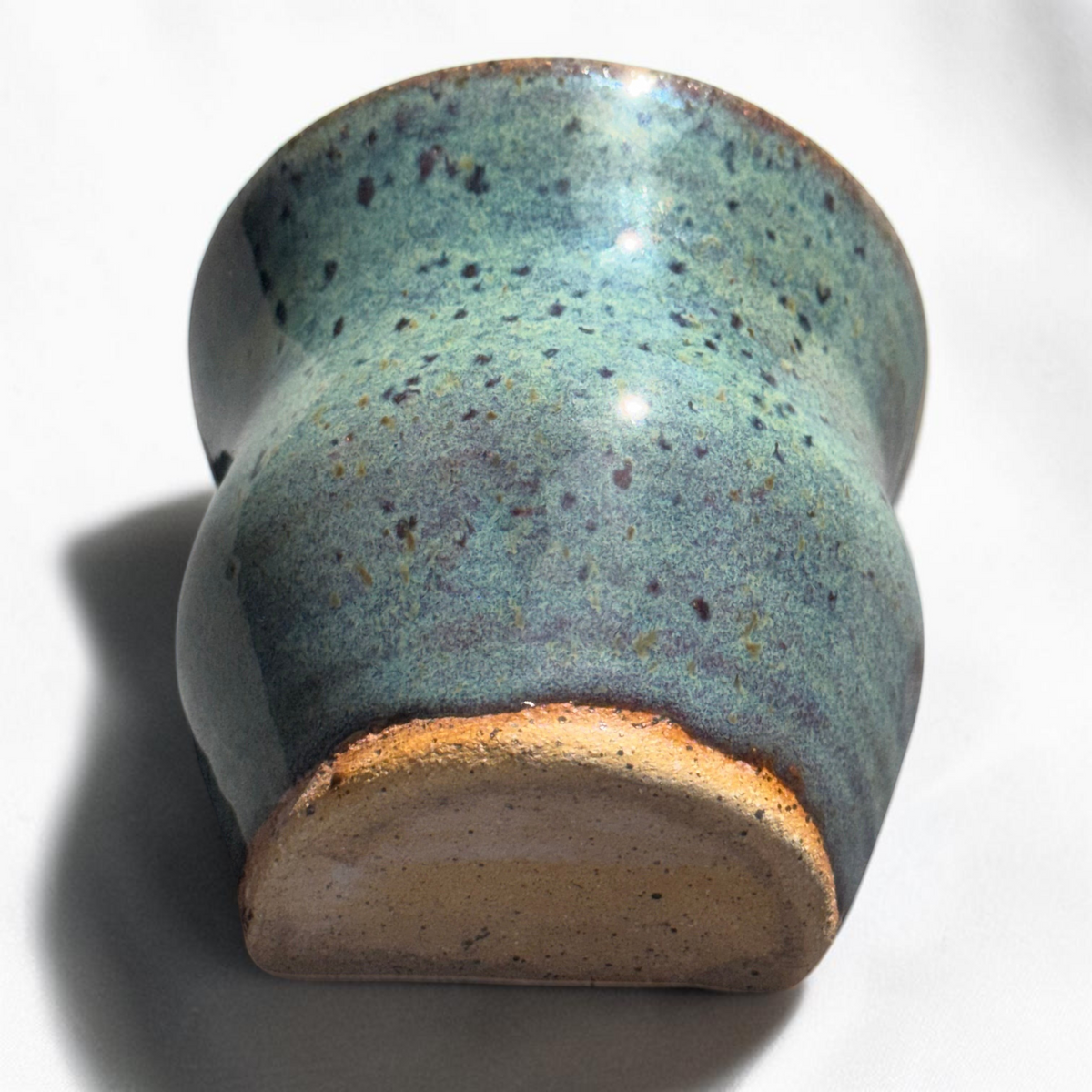 Rock N Art Shop handmade speckled stoneware wall pocket vase in a layered blue-green glaze with earthy brown accents.