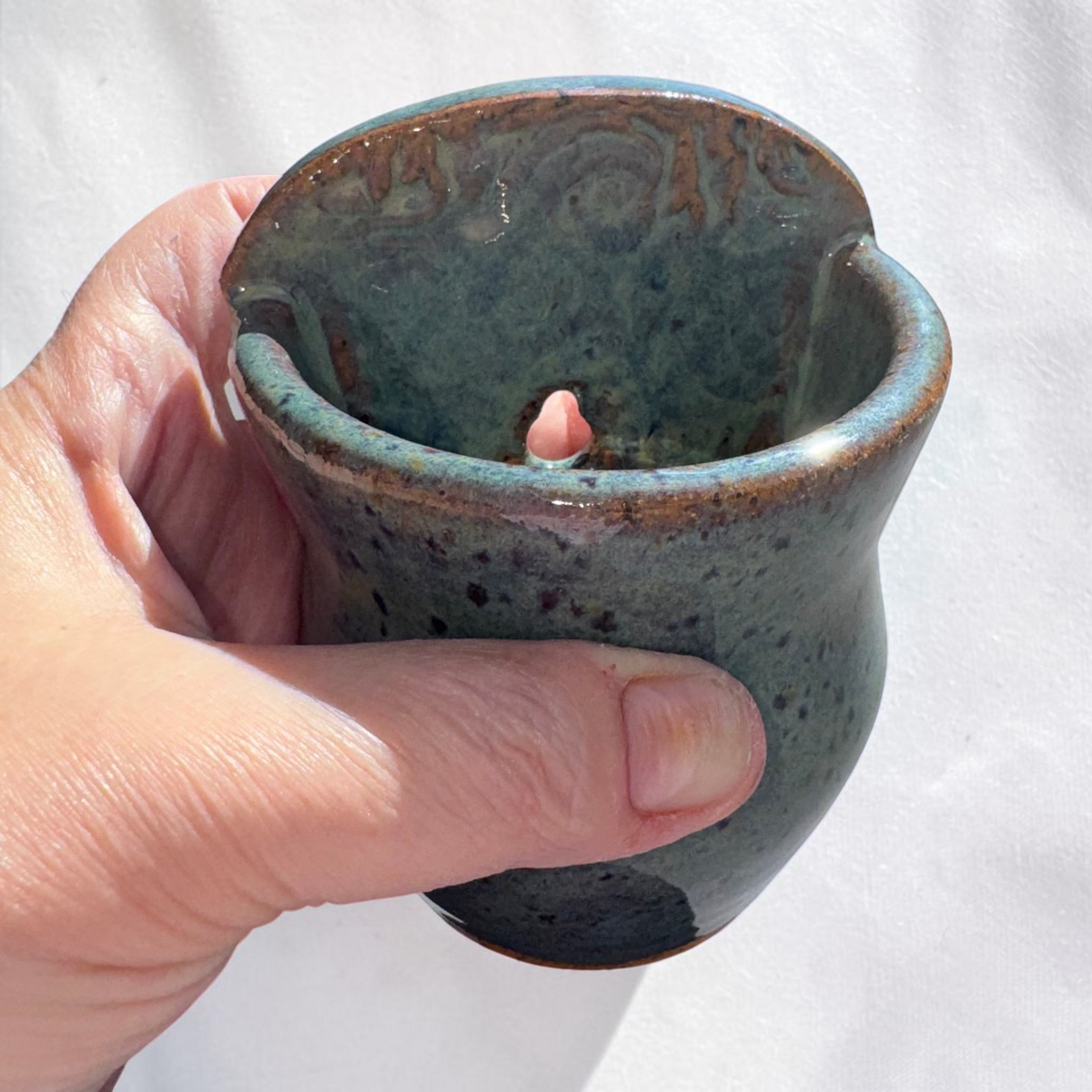 Rock N Art Shop handmade speckled stoneware wall pocket vase in blue-green glaze with textured impressed backplate