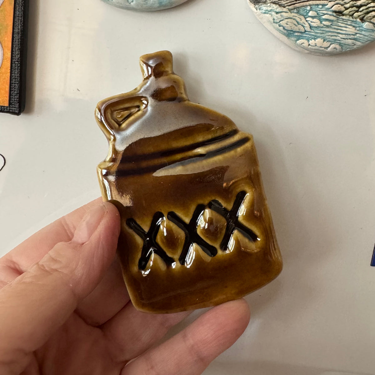 XXX Moonshine Jug Ceramic Magnet – Amber Brown