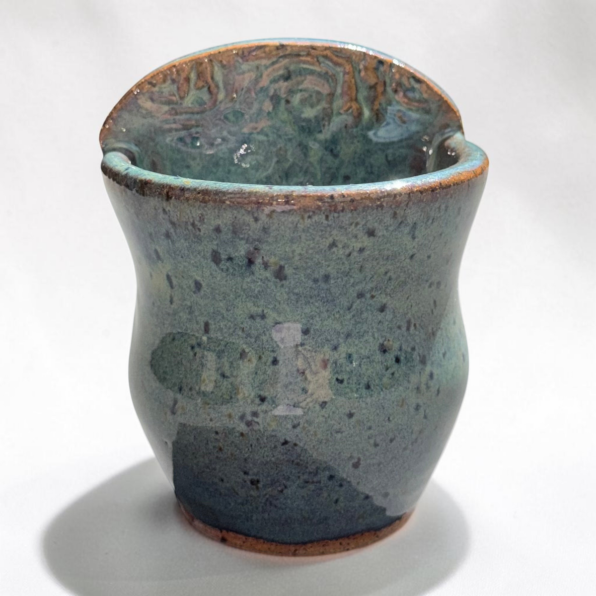 Rock N Art Shop handmade speckled stoneware wall pocket vase in a layered blue-green glaze with earthy brown accents.