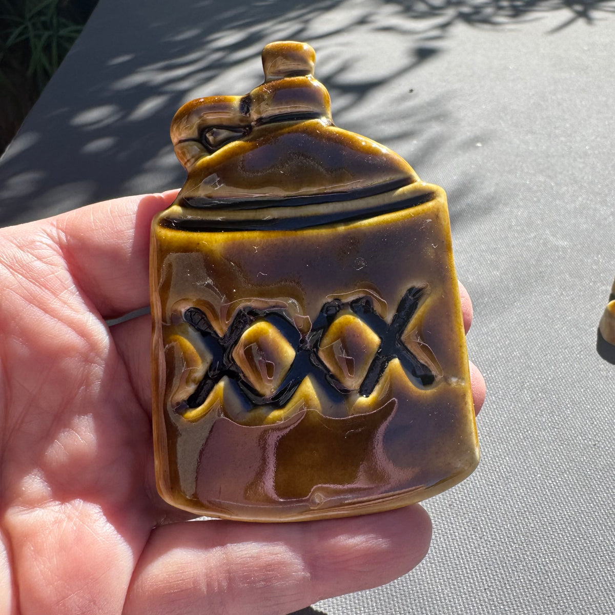 XXX Moonshine Jug Ceramic Magnet – Amber Brown