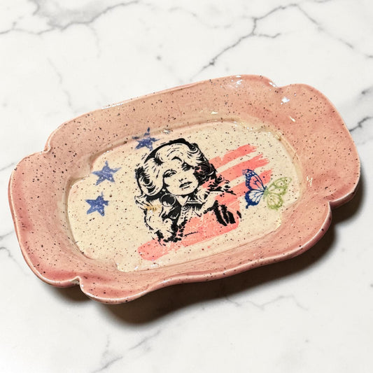 Rock N Art Shop handmade speckled ceramic trinket tray featuring a Dolly Parton pop art portrait with stars.