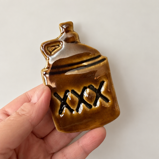 XXX Moonshine Jug Ceramic Magnet – Amber Brown