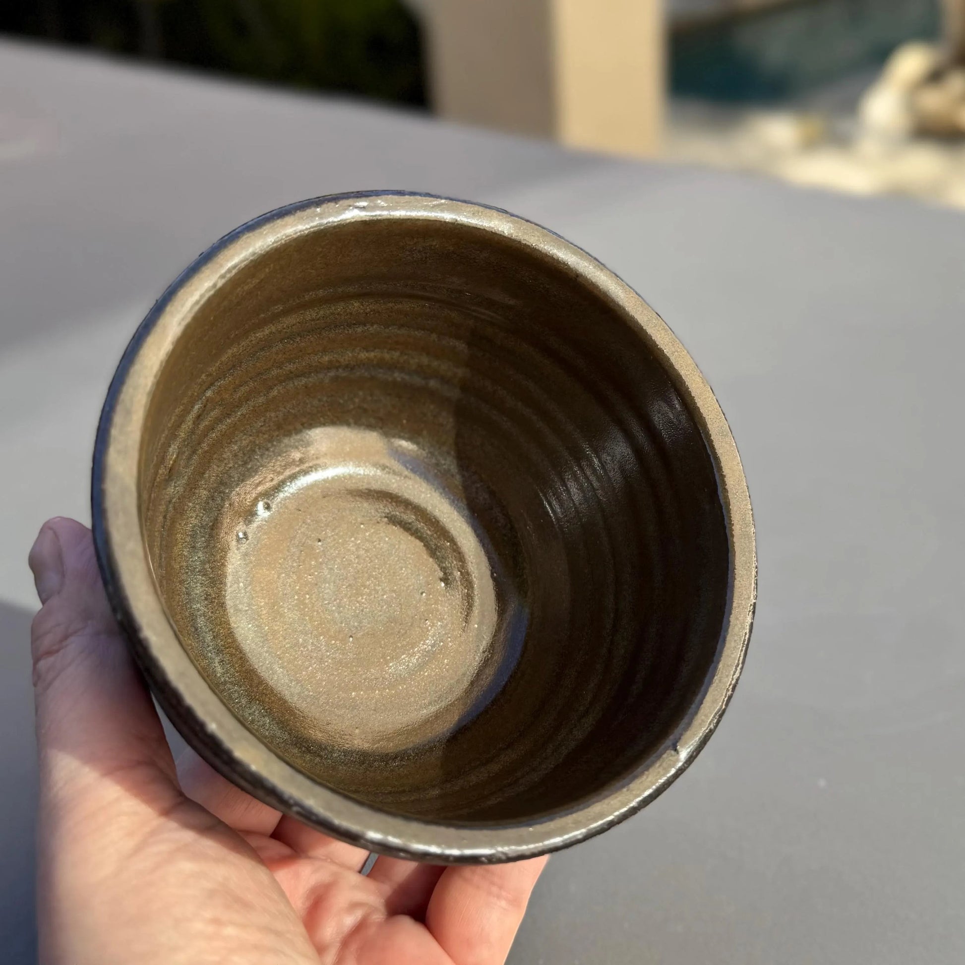 Rock N Art Shop handmade black clay ceramic bowl with iron lustre glaze interior. 1 cup capacity.