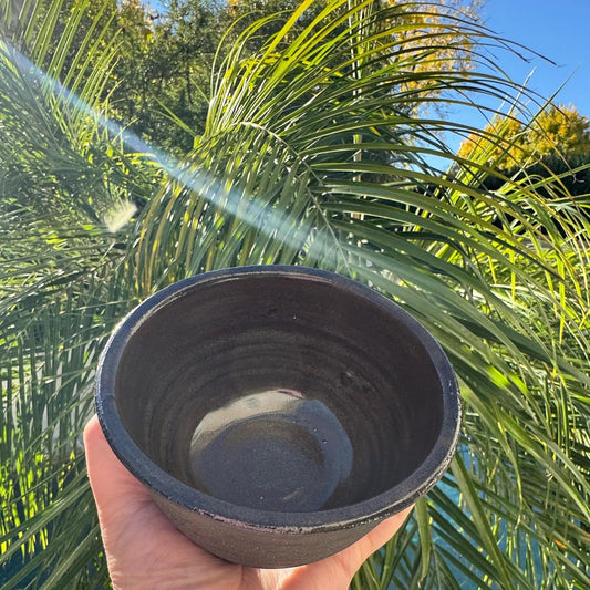Rock N Art Shop handmade black clay ceramic bowl with iron lustre glaze interior. 1 cup capacity, ideal for snacks or sauces.