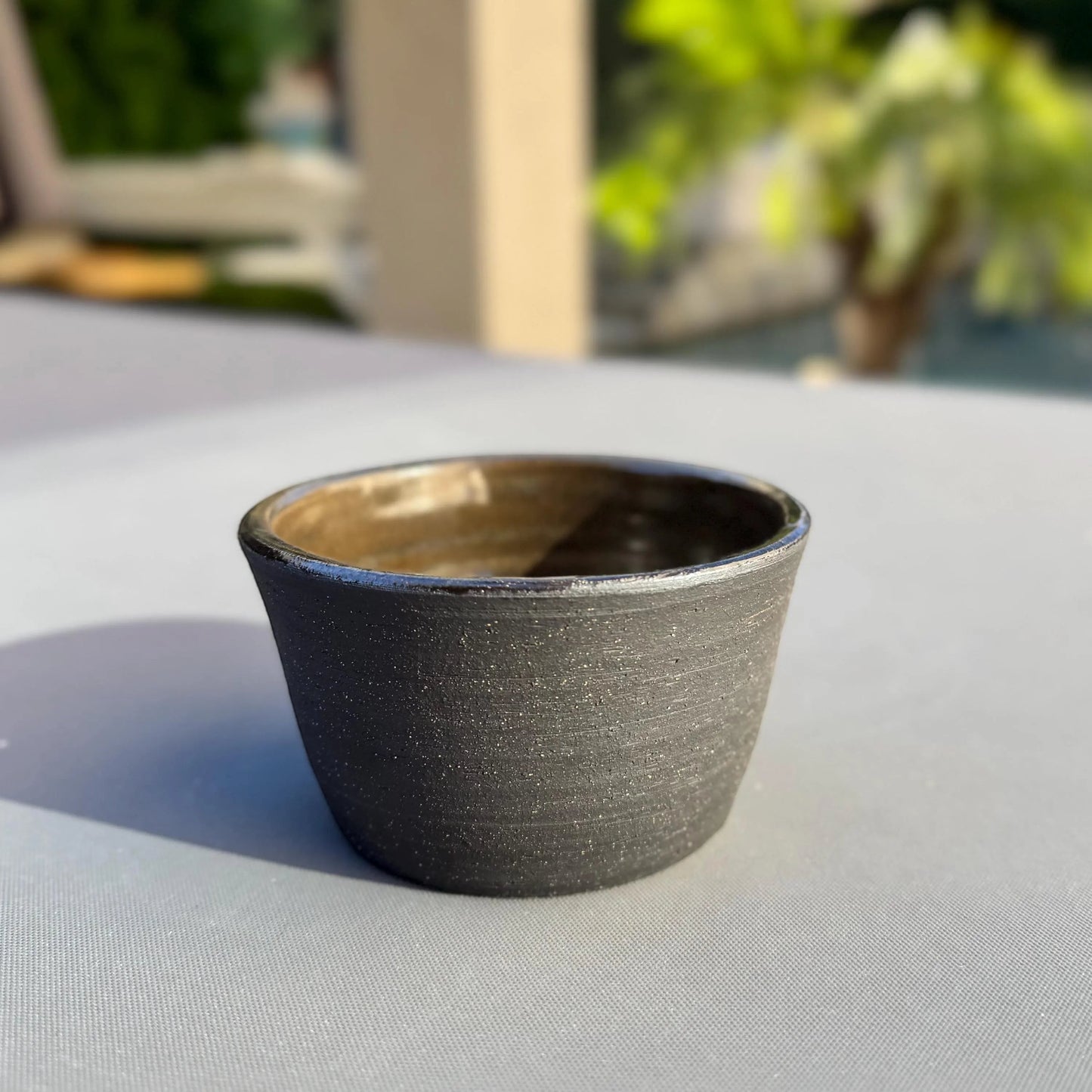 Rock N Art Shop handmade black clay ceramic bowl with iron lustre glaze interior. 1 cup capacity, ideal for snacks or sauces.