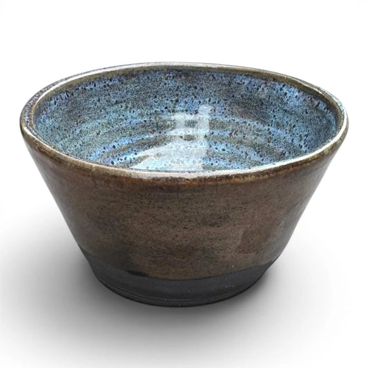 Rock N Art Shop large black stoneware bowl with blue and copper glaze. Wheel thrown pottery.