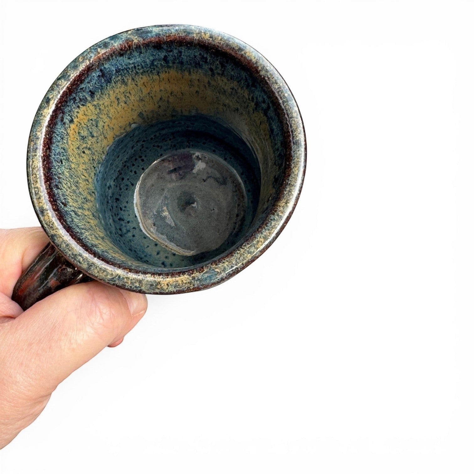 Rock N Art Shop handmade stoneware mug with blue, gold, and green drip glaze. Rustic wheel-thrown pottery, 14 oz.