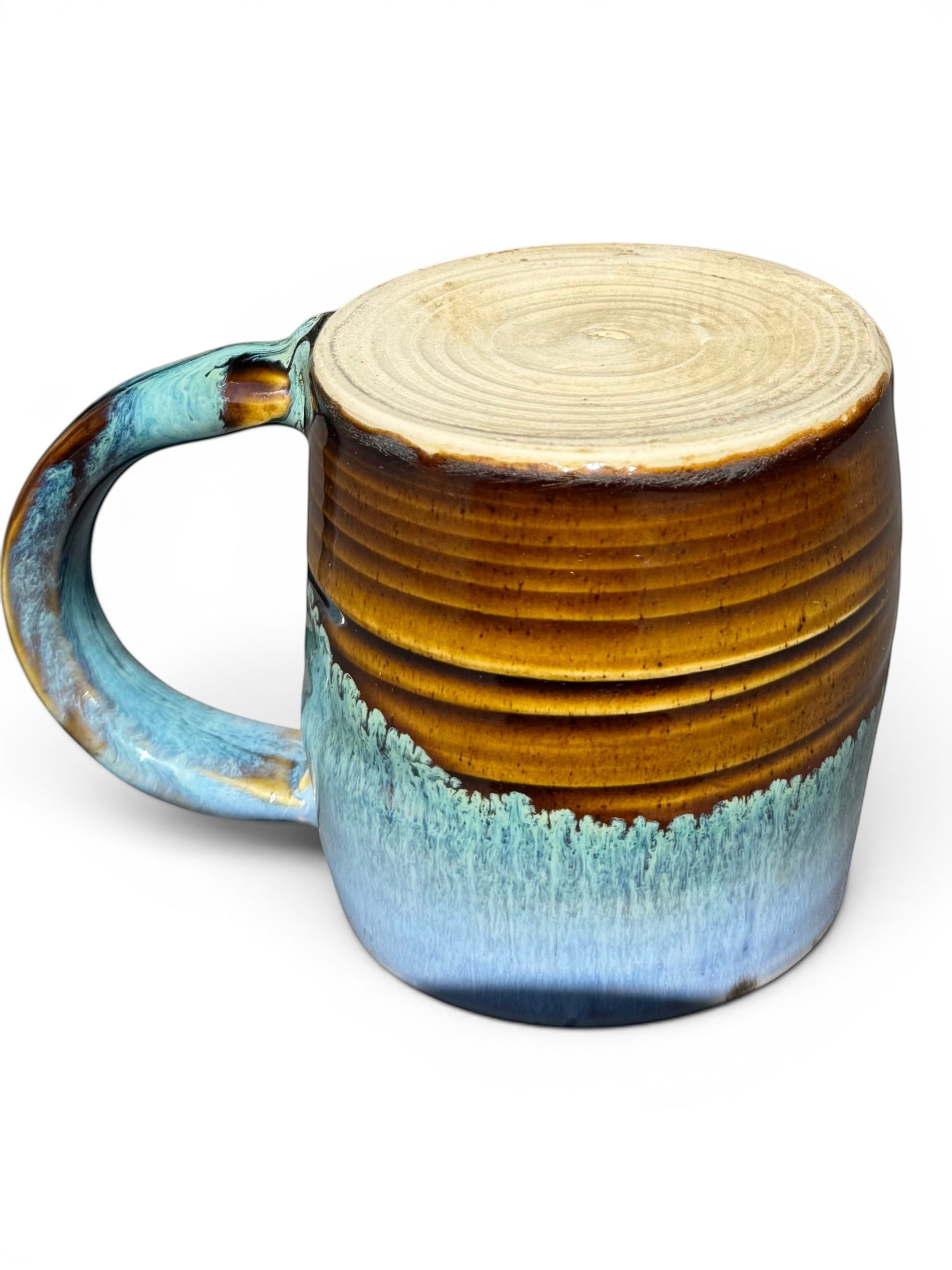 Rock N Art Shop Castile Blue & Turkish Amber 9 oz ceramic mug with glossy black interior and unique drip glaze.
