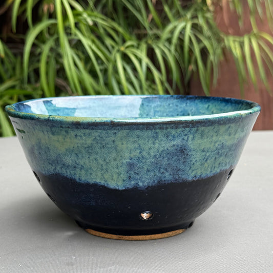 Rock N Art Shop handmade stoneware berry bowl with a blue and turquoise ocean-inspired glaze and drainage holes