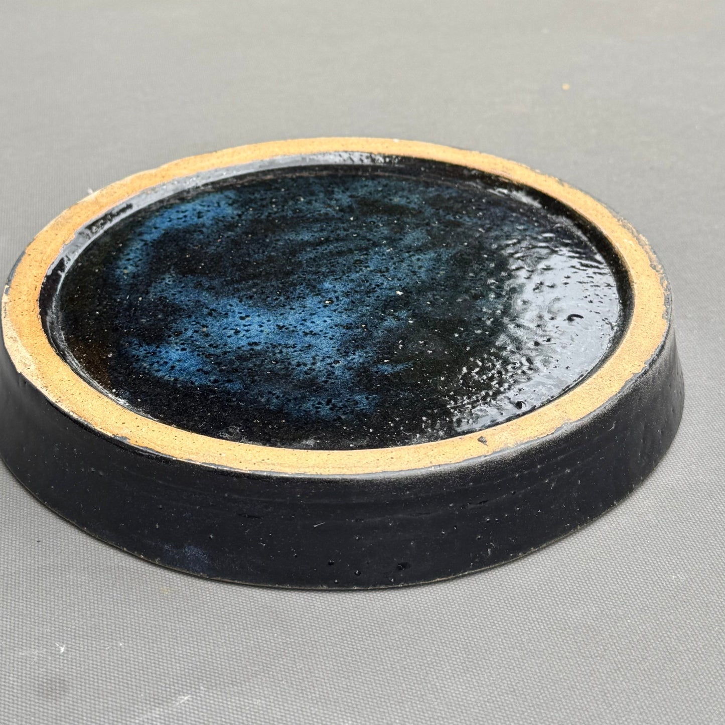 Rock N Art Shop handmade ceramic saucer in blue and turquoise glaze with an unglazed stoneware foot ring