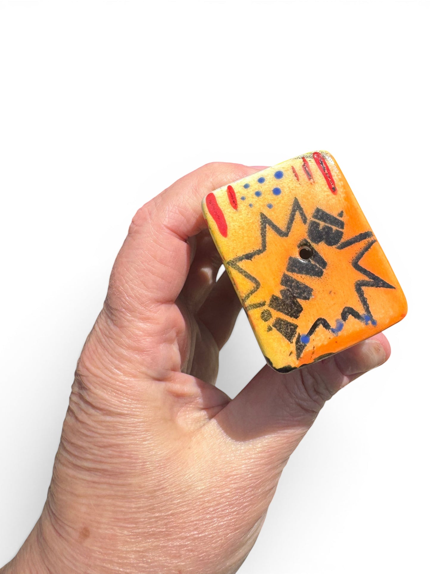 Rock N Art Shop Pop Art ceramic pipe with BAM! comic burst design, tangerine orange bowl, and cobalt star.