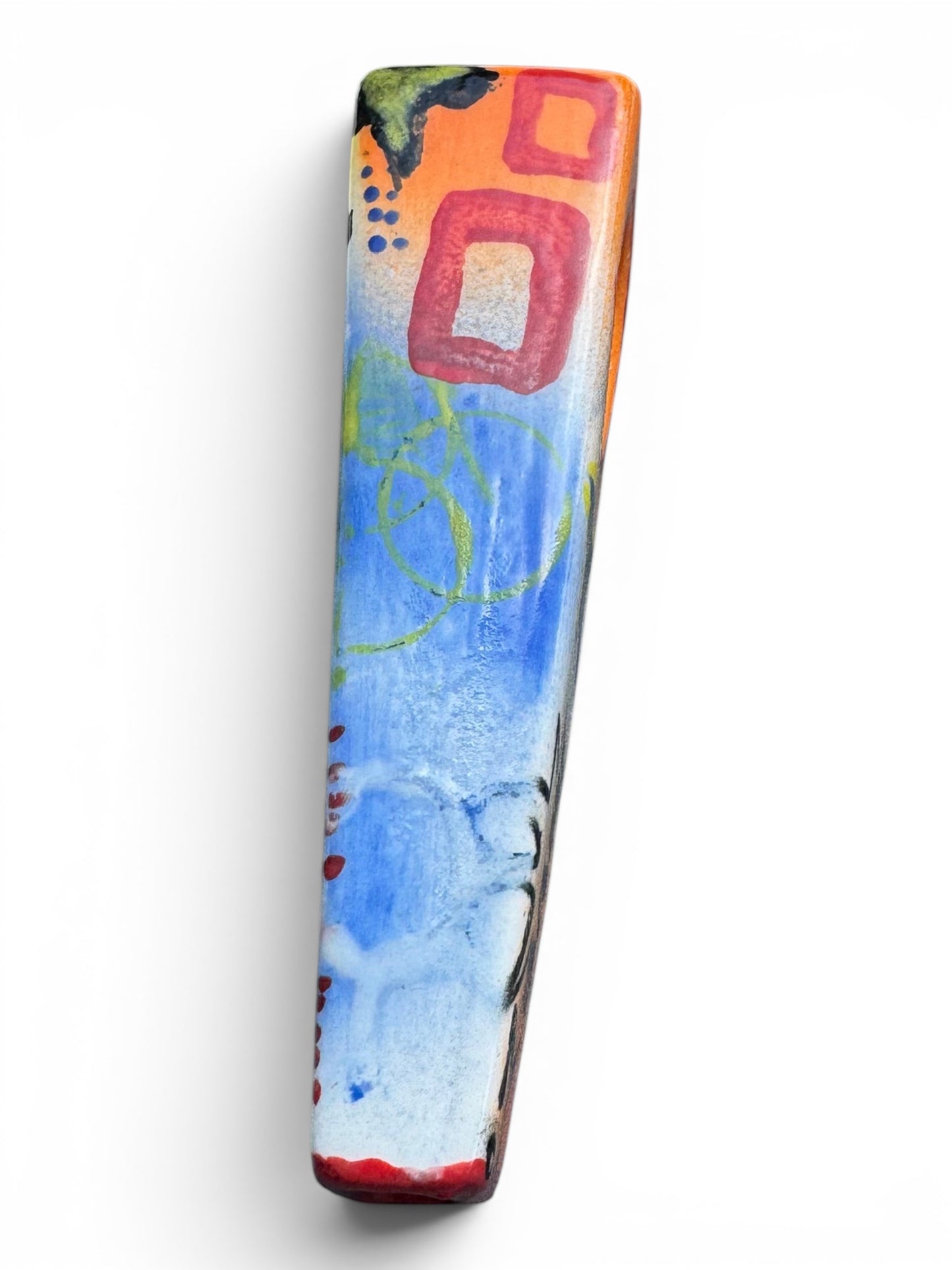 Rock N Art Shop hand-decorated ceramic pipe with pop art design, featuring orange, blue, yellow, and red details.