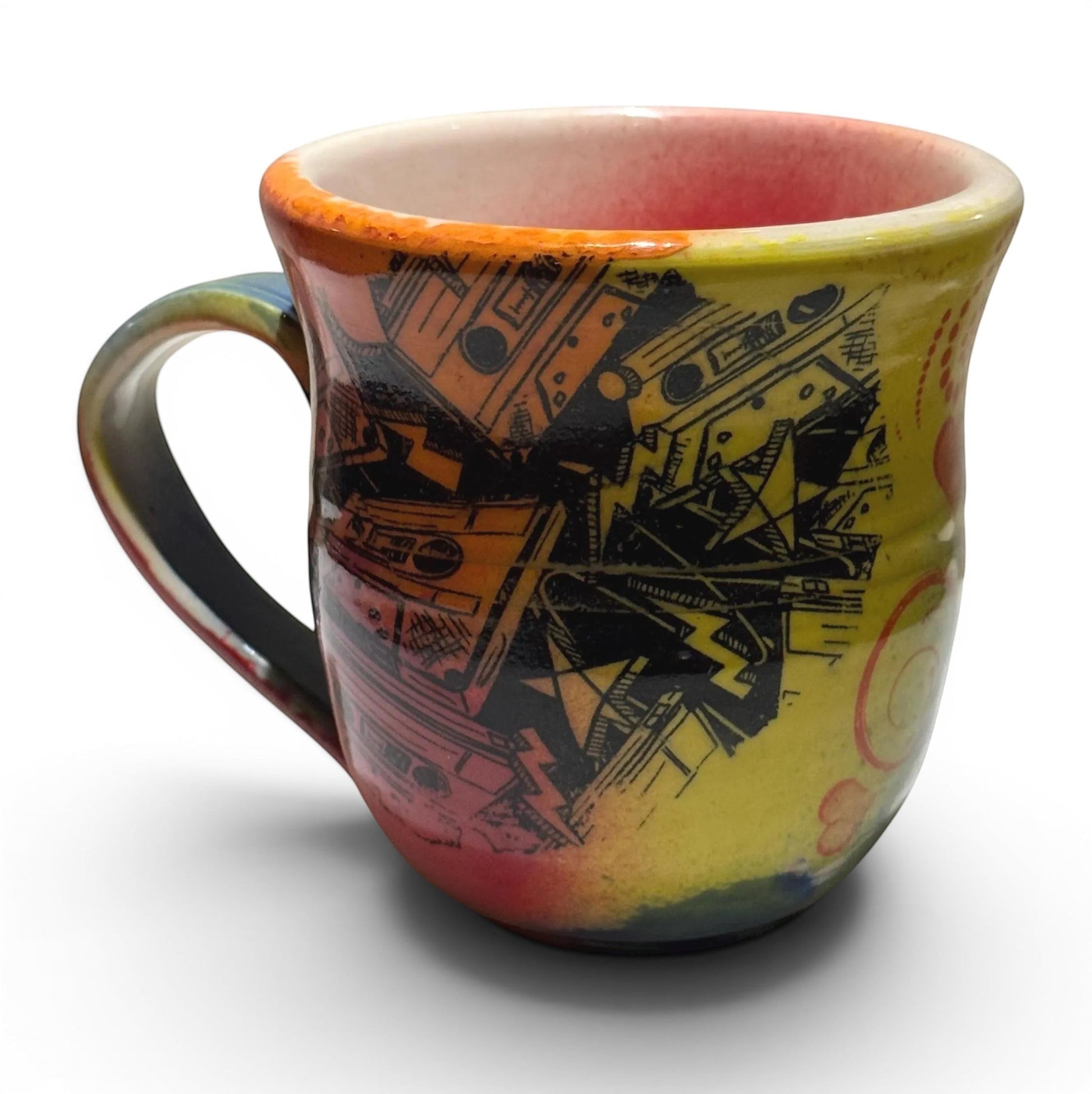 Rock N Art Shop handmade 12 oz ceramic coffee mug with a bold rock n roll Jesus design in yellow, orange, red, and black.