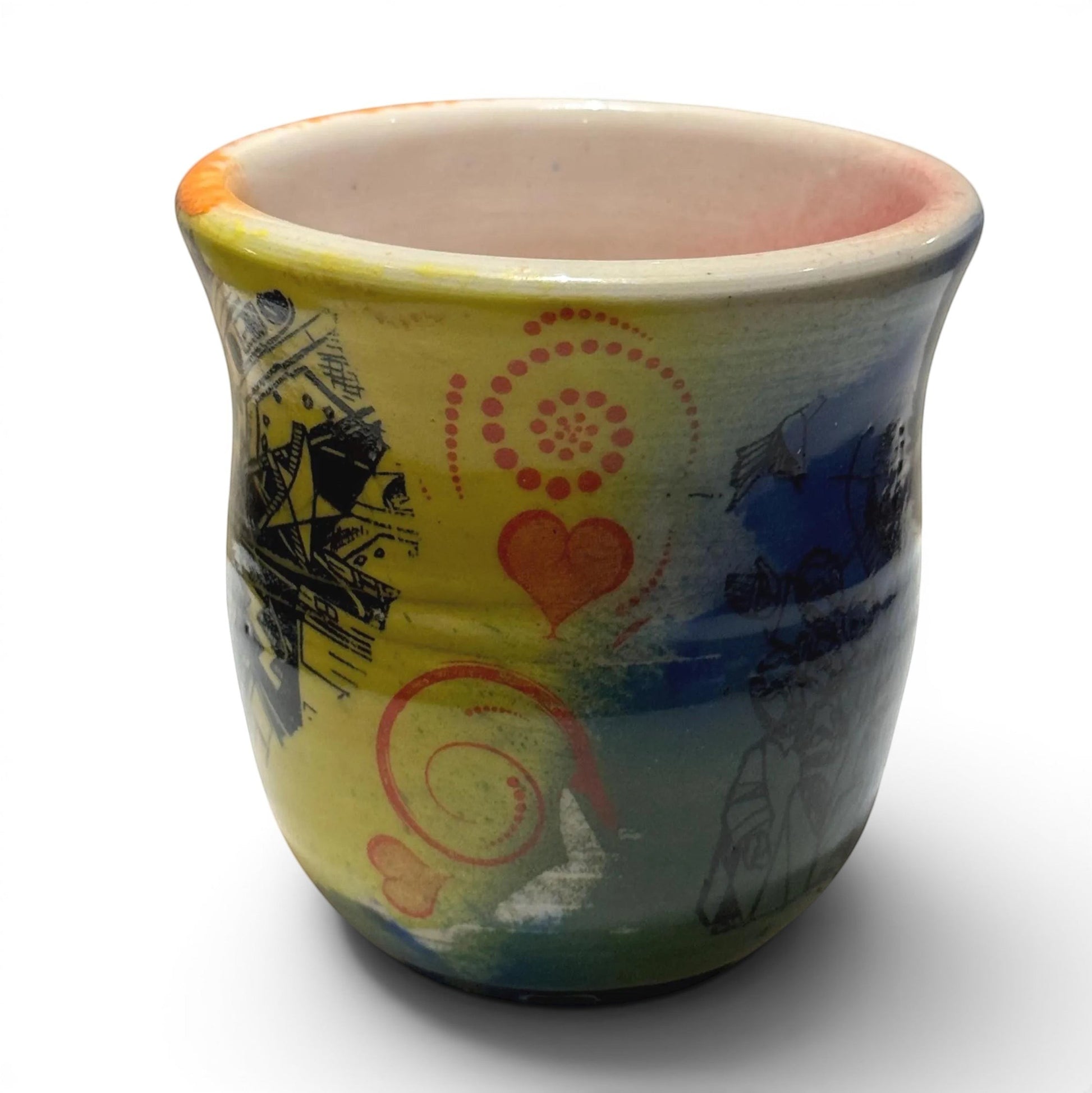 Rock N Art Shop handmade 12 oz stoneware mug with Rock N Roll Jesus art, yellow, blue, and orange glaze.