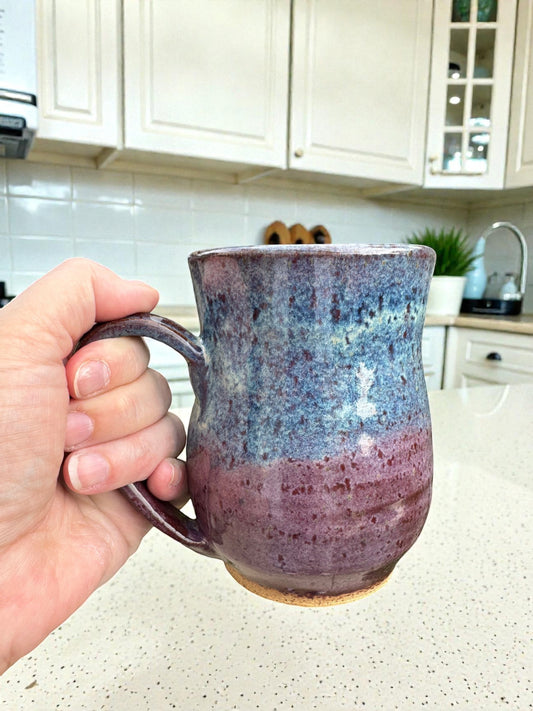Rock N Art Shop handmade 14 oz speckled blue and plum ceramic mug, wheel-thrown stoneware coffee cup with rustic artisan finish.