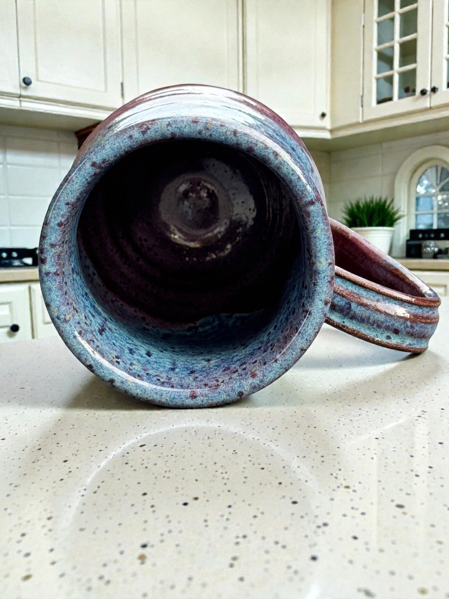 Rock N Art Shop handmade 14 oz speckled blue and plum stoneware mug. Wheel thrown pottery with rustic artisan finish.