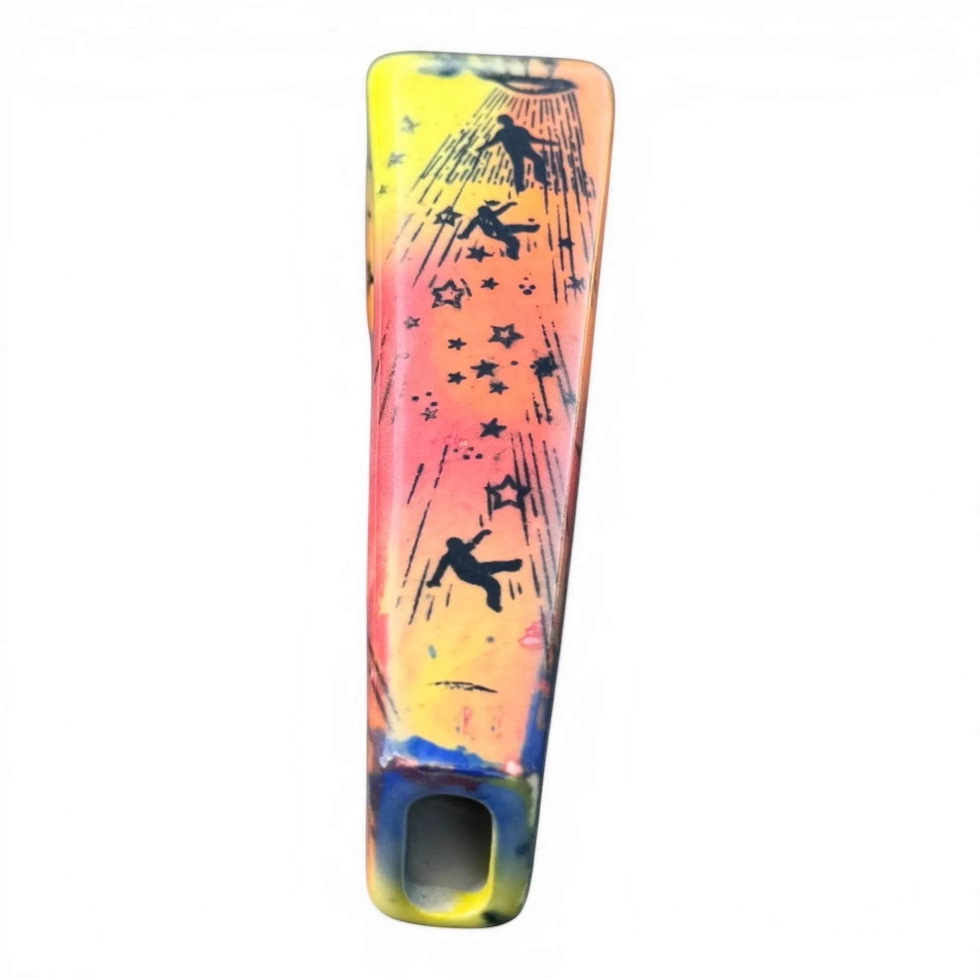 Rock N Art Shop hand-decorated ceramic pipe with UFO, falling figures, and stars design. Yellow, pink, and orange glaze.