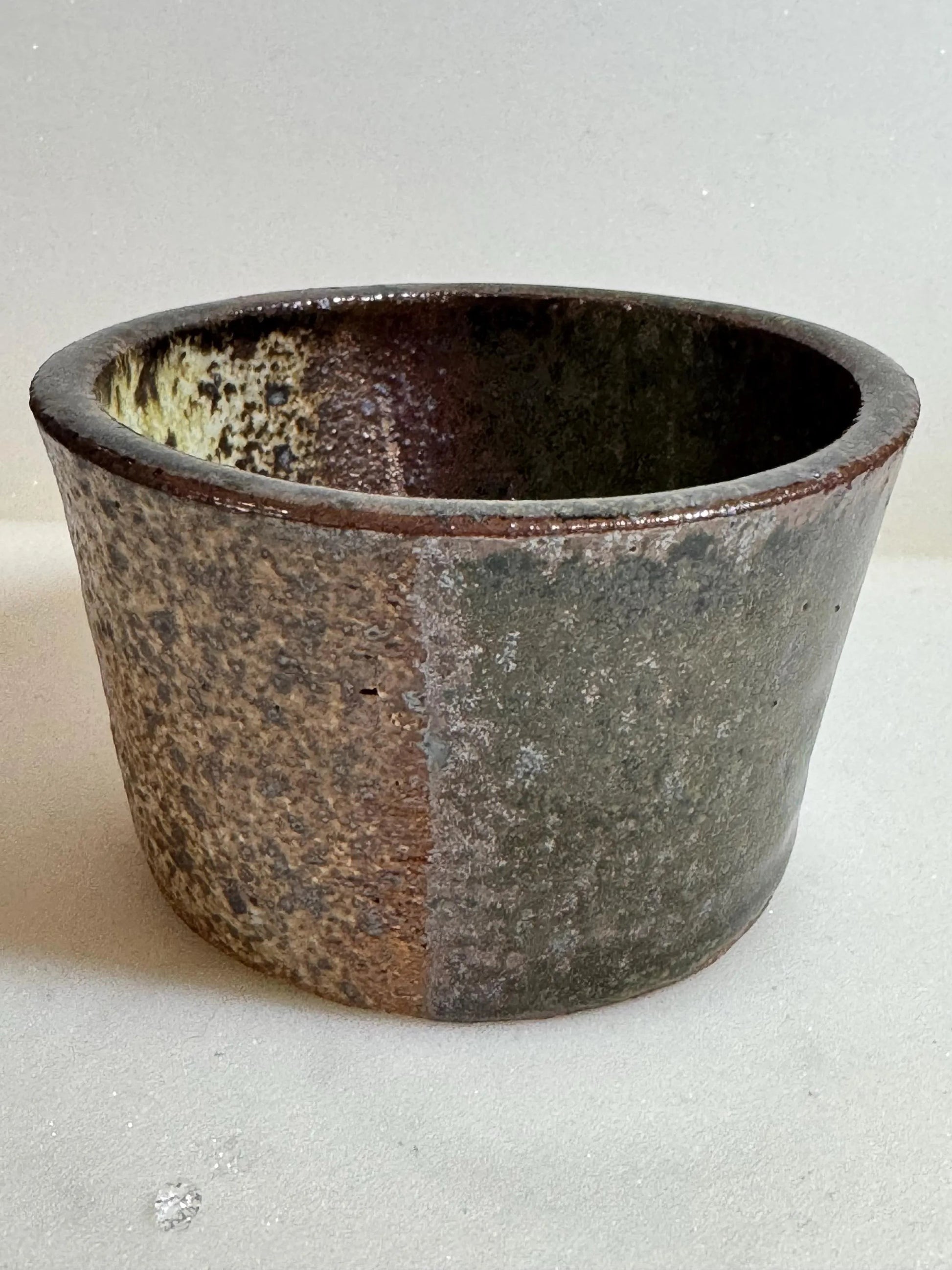 Rock N Art Shop Wabi Sabi ceramic bowl, 6 oz, handmade stoneware with earthy glaze in moss and brown tones.